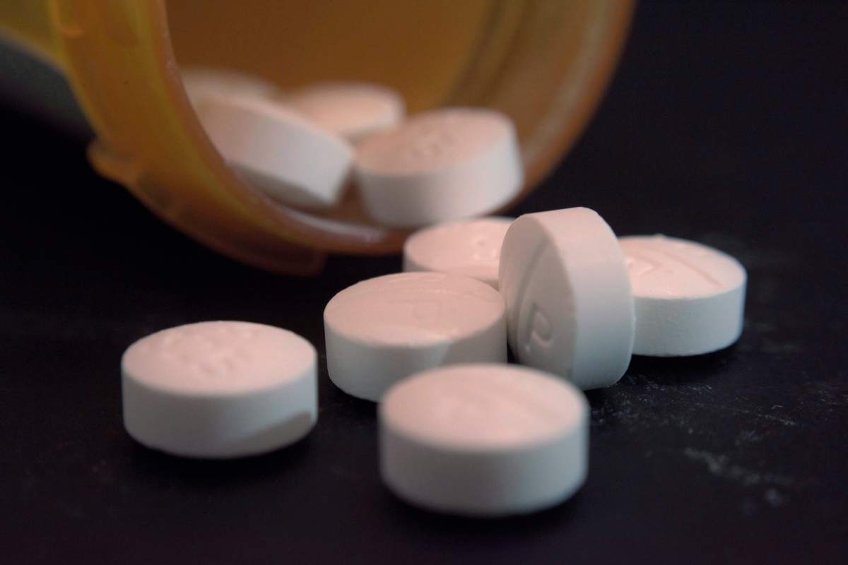 FILE - This Aug. 15, 2017, file photo shows an arrangement of pills of the opioid oxycodone-acetaminophen in New York. 